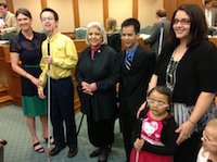 Young blind advocates pose with guides and Sen. Zaffirini.