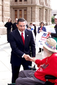 State Rep shakes hands with long time disability advocate Bob Kafka outside the state Capitol building